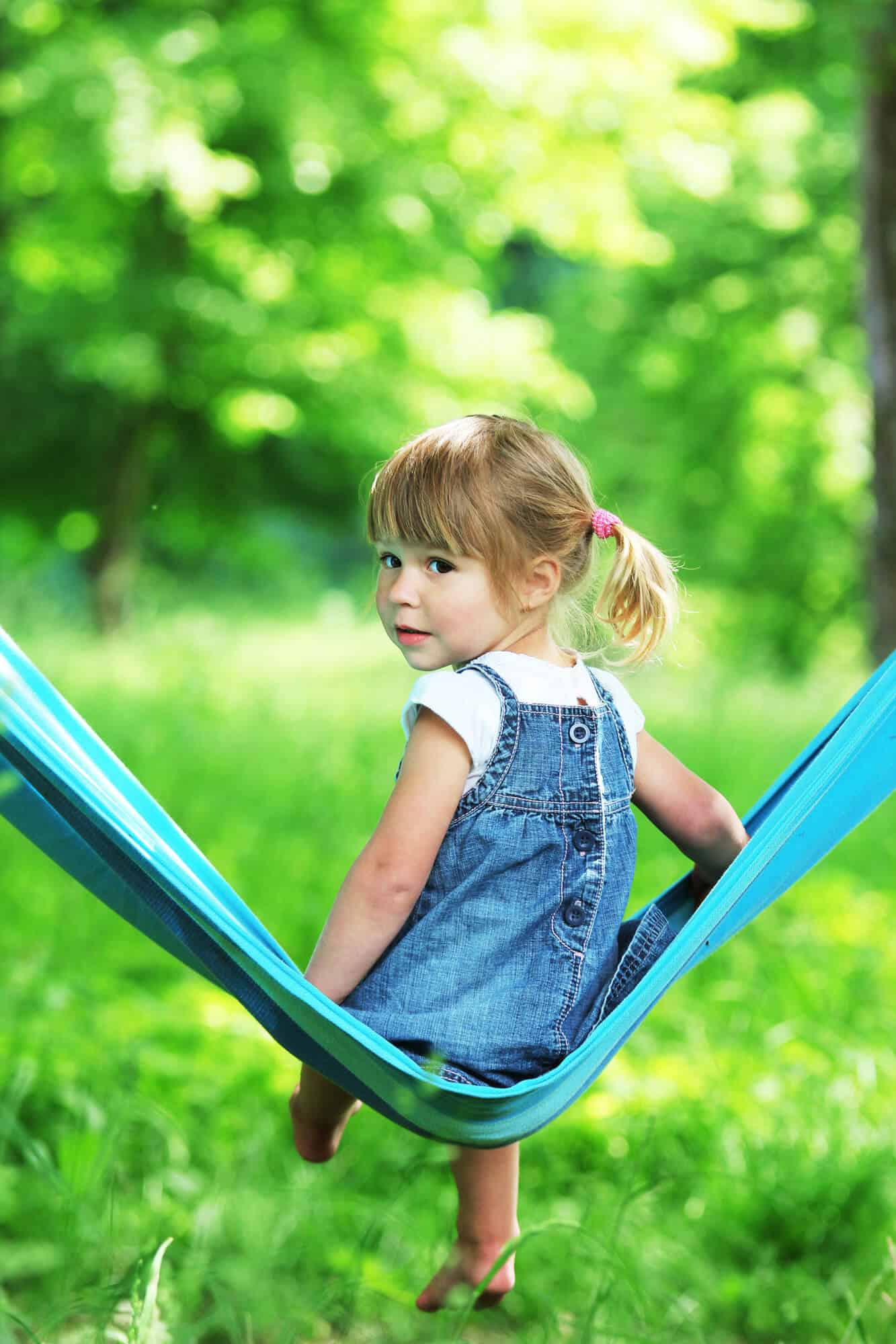 quiet girl sitting in a hammock