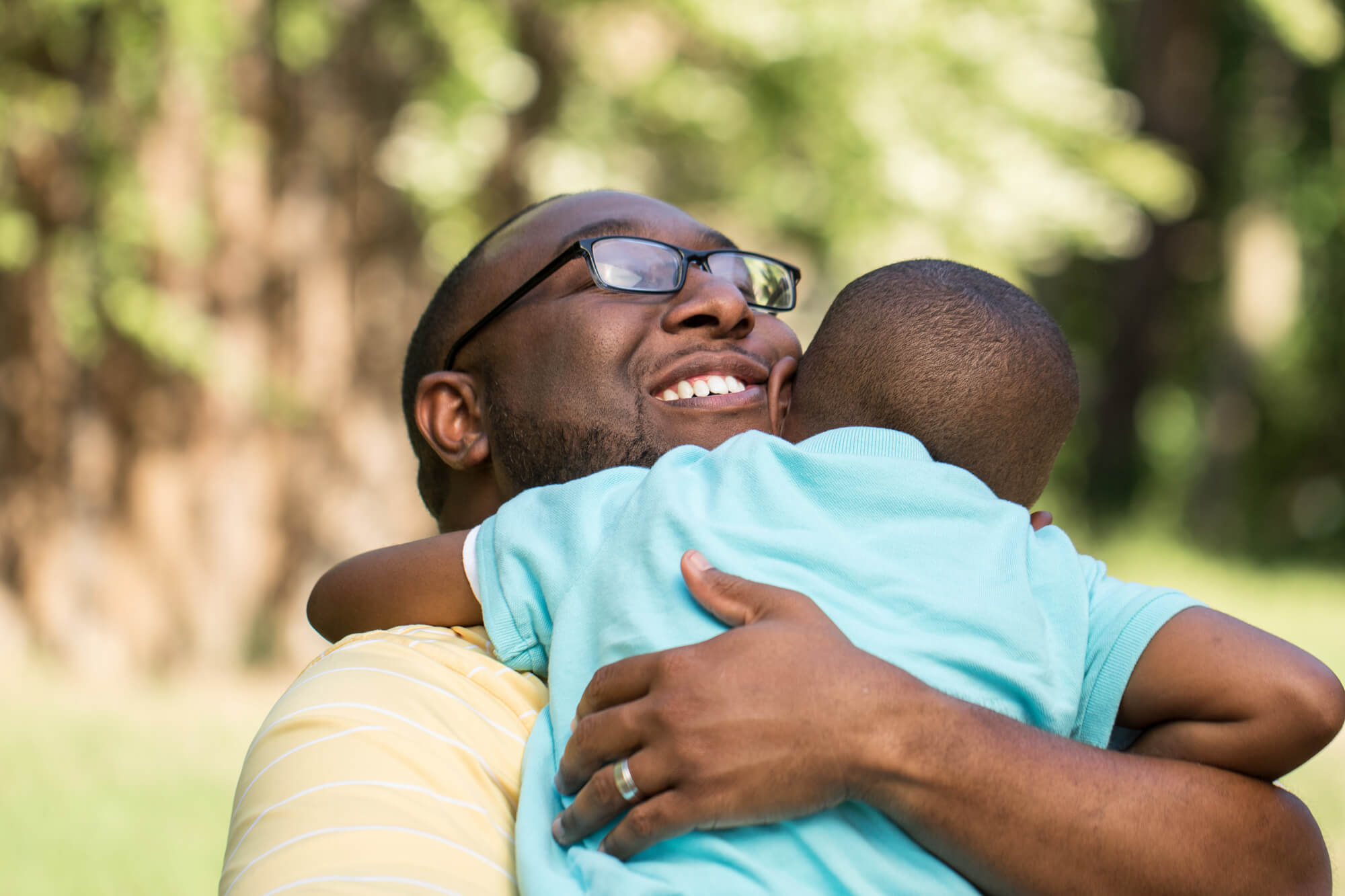 dad hugging son